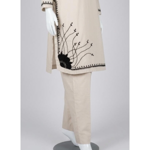 Hand embroidered stitched cotton shalwar kameez in skin color.